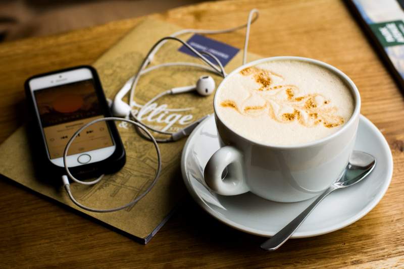 smart phone next to coffee mug