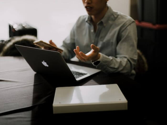 man gesticulating on video call