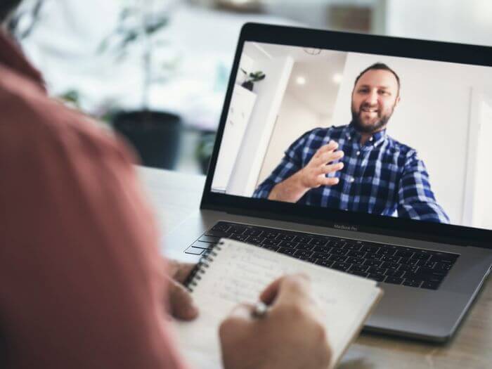 man on screen teaching English online