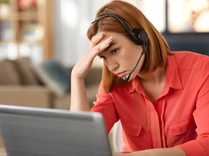 woman with Zoom fatigue staring at laptop screen