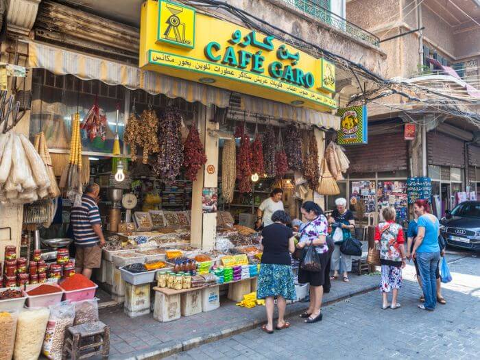 This image has an empty alt attribute; its file name is People-on-the-street-in-Beruit-Lebanon-buying-food.jpg