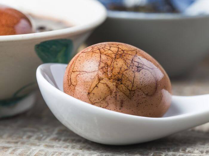 Chinese tea egg on a spoon