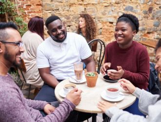 Group of friends chatting at a café