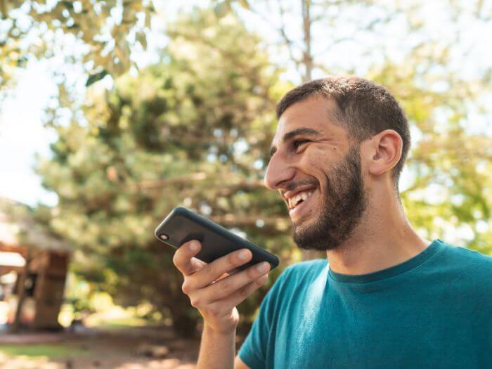 Man speaking Spanish with an AI chatbot