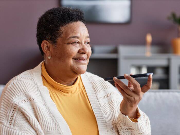 woman speaking to AI app 