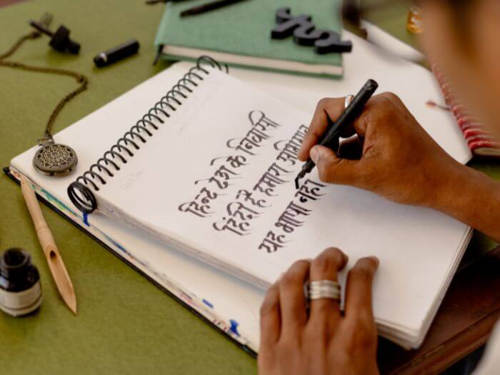 a person writing in a notebook