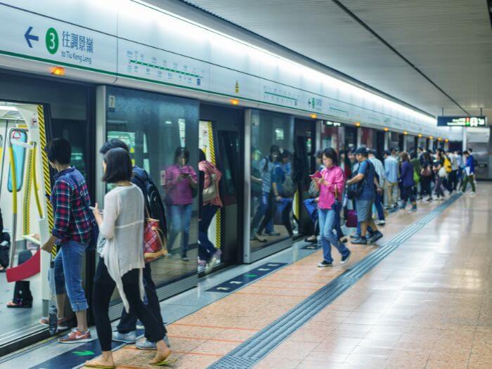 People getting onto a train in the Hong Kong metro