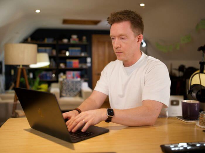 Olly working hard on laptop