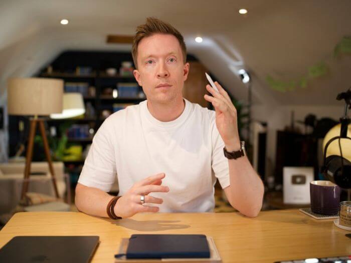 Olly Richards at desk with a stylus in his hand